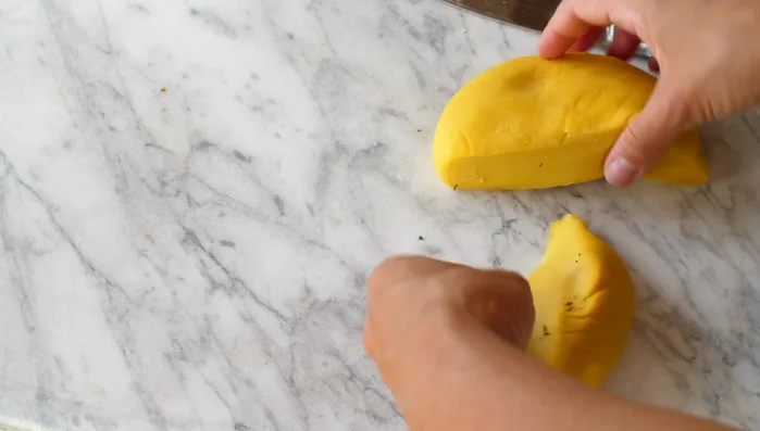 Roll out the pasta dough: Use a pasta machine or rolling pin to create thin sheets of pasta.