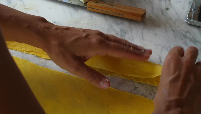 Assemble the ravioli: Spoon the filling onto one sheet of pasta. Top with another sheet and press to seal, removing air bubbles. Cut into individual ravioli.