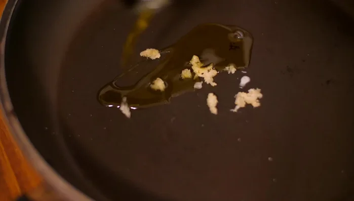 Prepare the sauce: Sauté garlic in butter and olive oil. Add lemon juice and fresh sage.