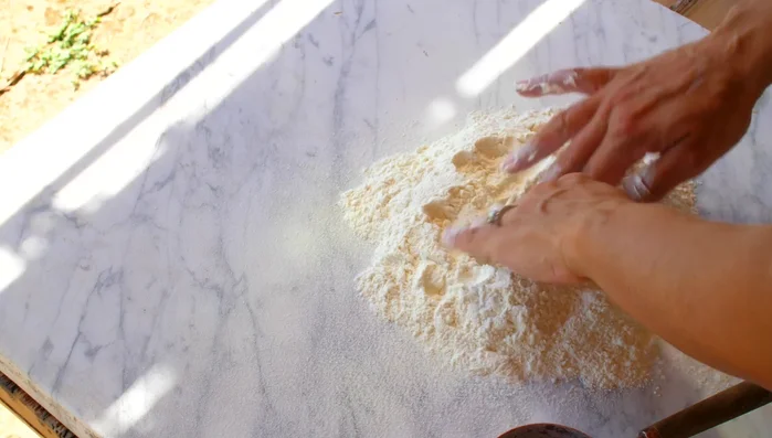 Prepare the pasta dough: Combine 00 flour, eggs, and egg yolks. Knead until smooth and elastic. Let it rest for at least an hour.