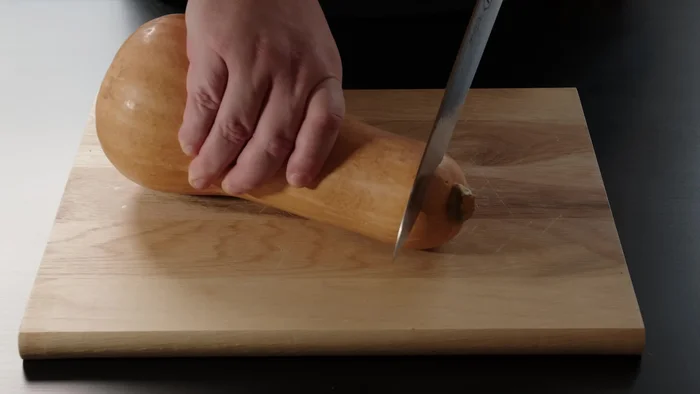 Cut the pumpkin into pieces for faster cooking.