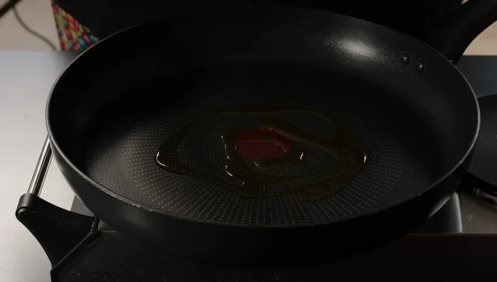 Add olive oil and garlic to a pan.