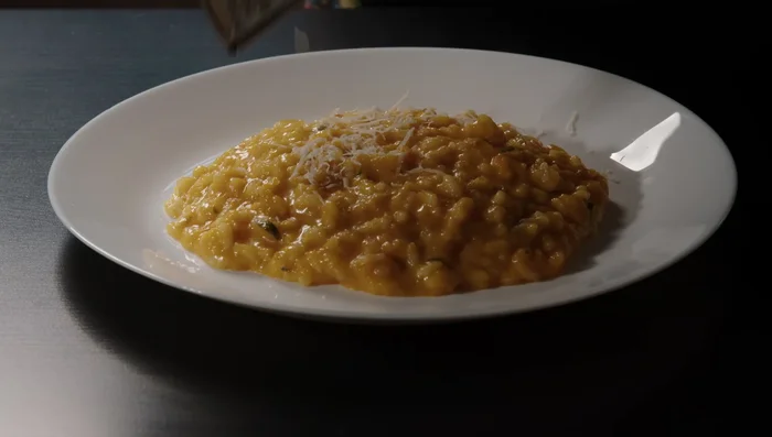 Serve the risotto and top with Parmesan, gorgonzola, extra parsley, and olive oil.