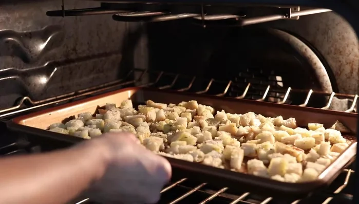 Spread croutons on a baking sheet in a single layer. Bake for 15 minutes, stir, then bake for another 5 minutes, or until golden brown. Let cool completely. (84.119)