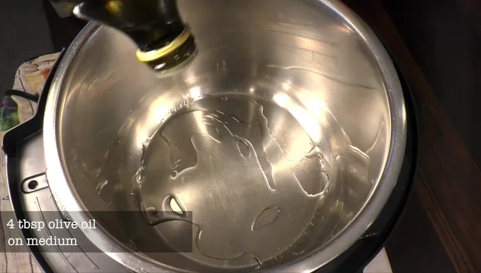 Heat olive oil in a pot over medium heat. Add onion and celery, and cook until tender.