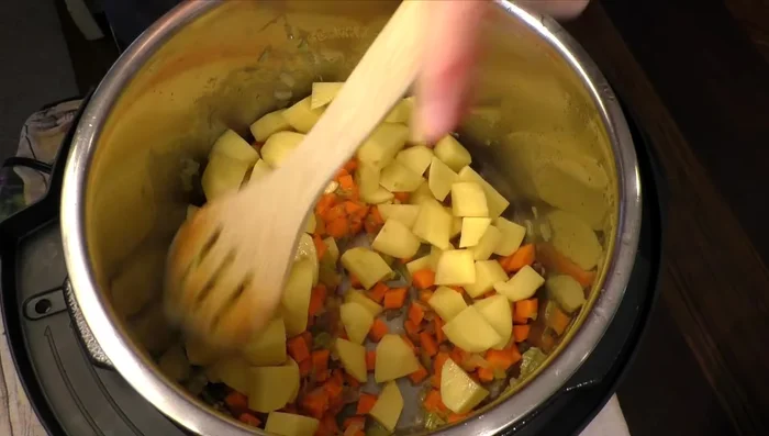 Add carrots and potatoes to the pot and cook for about 8 minutes.