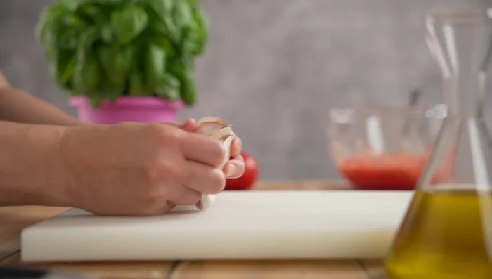 Lightly crush the garlic (210.72) and basil (214.4).