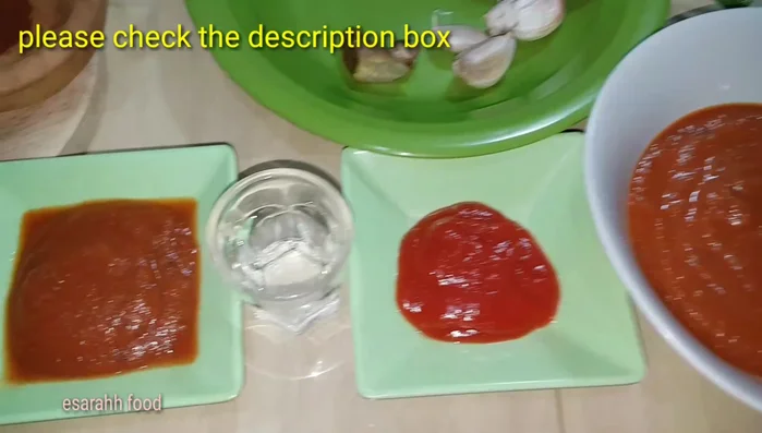 Divide the tomato sauce into two portions.