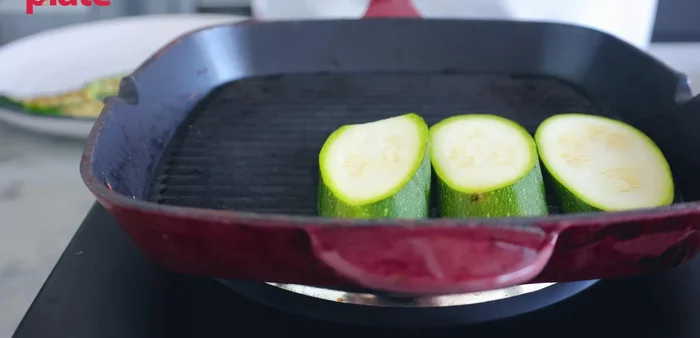 Grill the zucchini slices until nicely browned on both sides, creating those beautiful grill marks. This should take about 3-5 minutes per side.