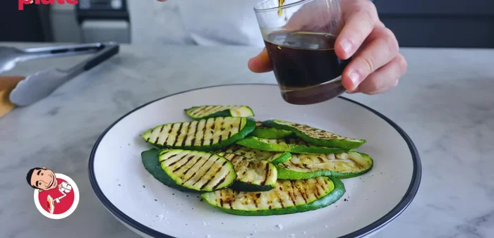 Drizzle the prepared dressing generously over the zucchini.