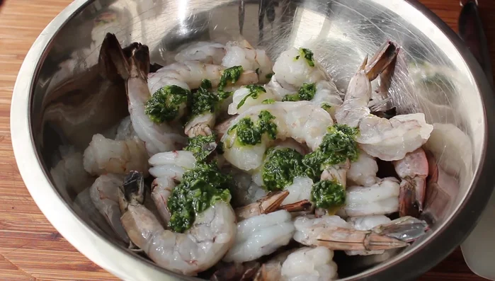Transfer two-thirds of the herb mixture to a plastic bag, add the shrimp, and mix thoroughly. Marinate in the refrigerator for at least three hours.