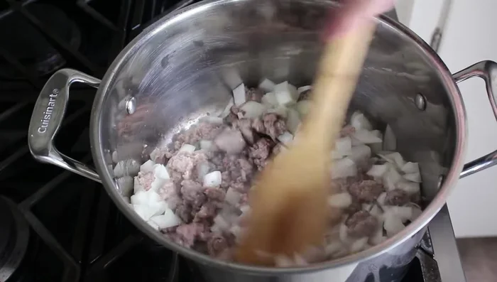 Add diced onion and cook for about 5 minutes until softened.