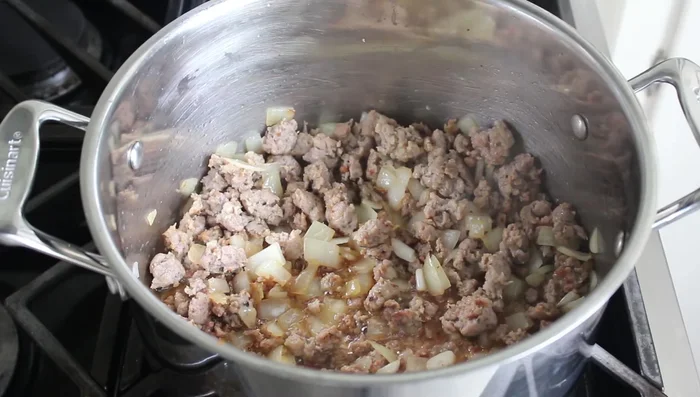 Add black pepper, red chili flakes, and a bay leaf.