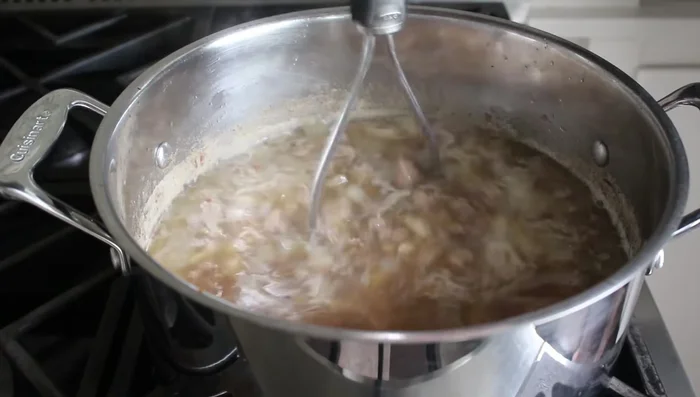 Once beans are tender, mash about 20-25 beans for creamier texture (optional).