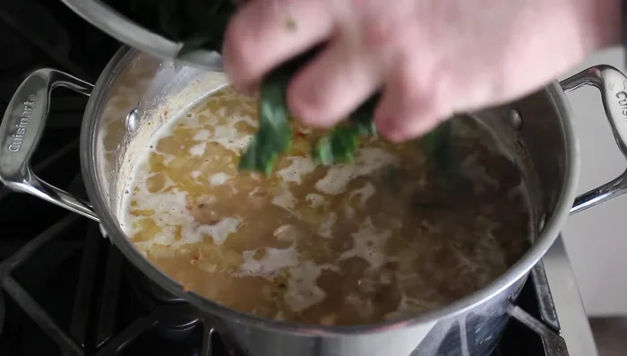Stir in chopped greens and cook over medium heat until tender (about 15 minutes).