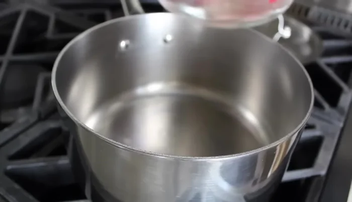 Heat 4 cups of water (or chicken broth) in a saucepan over high heat until it boils.