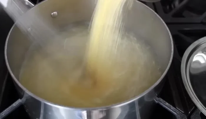 Whisk the polenta into the boiling water constantly in a steady stream to prevent lumps.