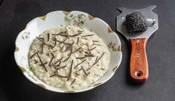 Serve immediately, topped with extra fresh black truffles.
