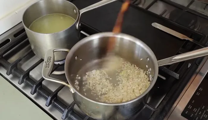 Add white wine and let it absorb completely.