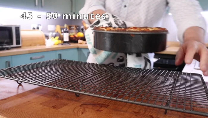 Bake in a preheated oven at 170°C (340°F) for approximately 50-60 minutes, or until a skewer inserted into the center comes out clean. Cover with foil if the top browns too quickly.