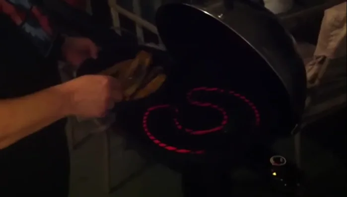 Place the marinated squash slices on the preheated grill.
