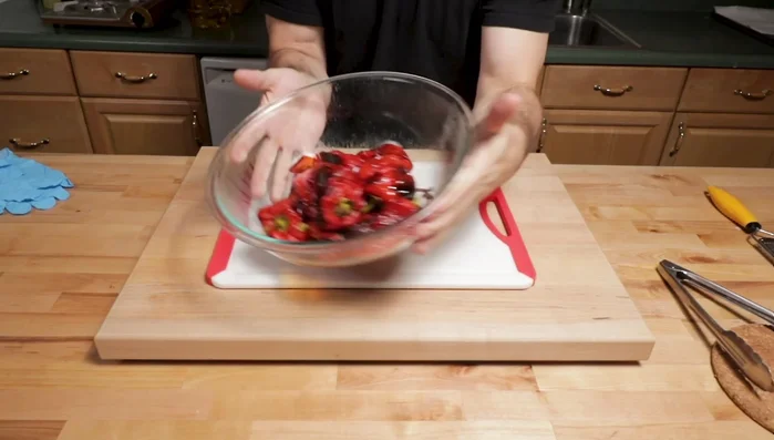 Once the peppers are cool enough to handle, peel off the skins.