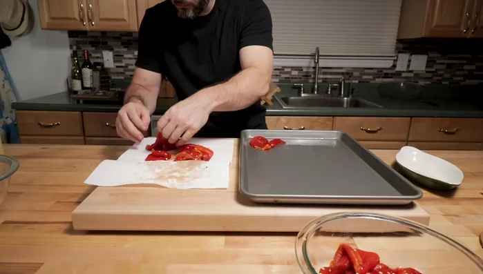 Lay the peppers flat on the baking tray.