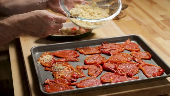 Sprinkle the seasoned breadcrumbs over the peppers.