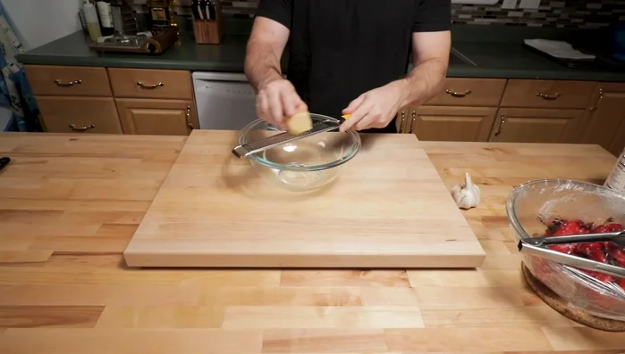 Grate the Parmigiano-Reggiano cheese.
