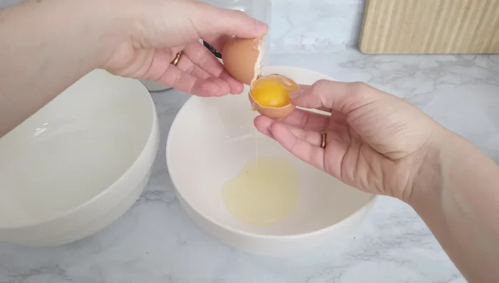 Separate egg yolks from whites. Whisk yolks with sugar until light yellow. [50.68]