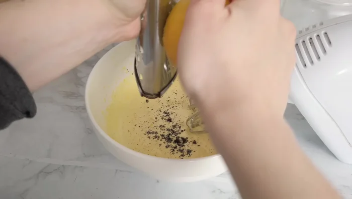Add vanilla extract (optional), lemon zest, drained ricotta cheese, milk, and soft butter. Whisk until smooth. [61.64]