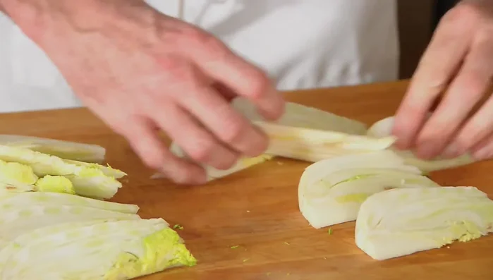 Drizzle the fennel pieces with olive oil, salt, and pepper.
