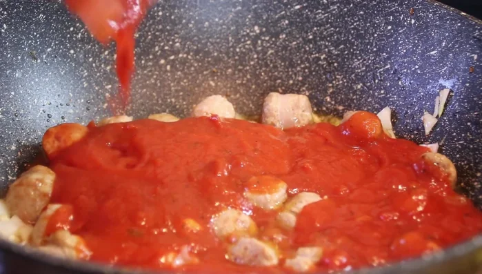 Add spaghetti sauce and heirloom crushed tomatoes.