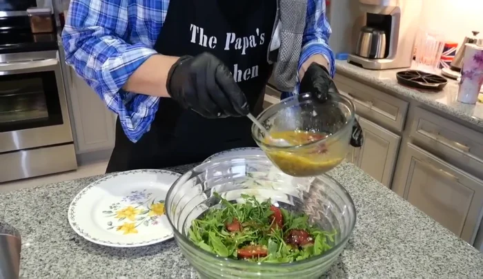 Toss the arugula with the remaining vinaigrette.