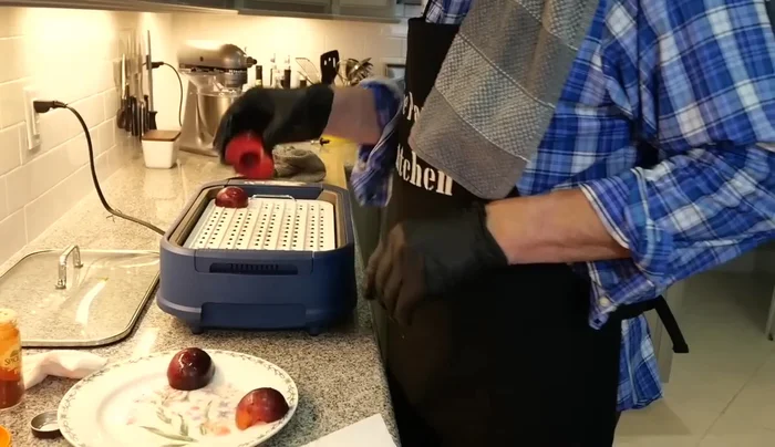 Place the plums cut-side down on the preheated grill and cook for about 2 minutes, until charred.