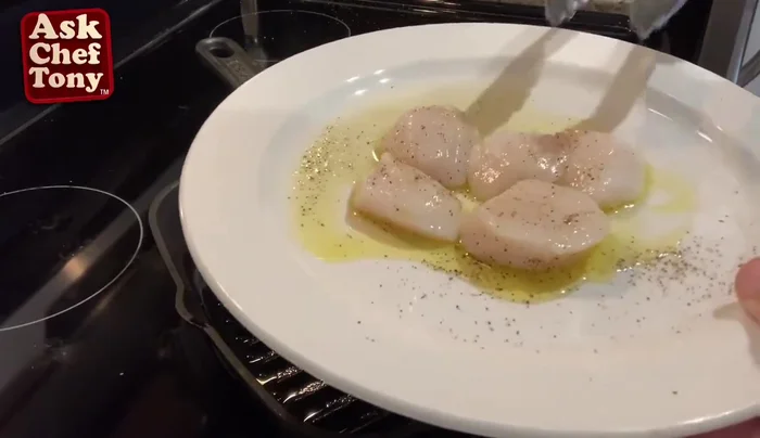 Prepare the scallops: Season with salt, pepper, and olive oil.