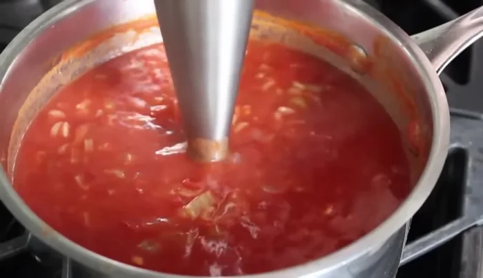 Using an immersion blender, blend the soup until completely smooth. This may take a few minutes.