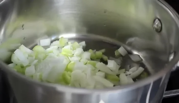 Heat olive oil in a soup pot over medium heat. Add onions and celery with a big pinch of salt and cook for 5-6 minutes until softened and translucent.