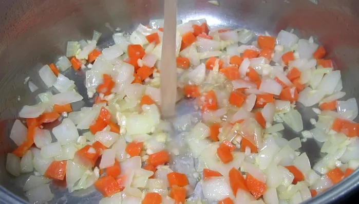 Slowly add chicken broth (low sodium if using canned/boxed). Bring to a simmer.