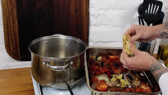 Remove tomato vines and skins (1:07.719). Pour everything into a saucepan (1:13.399).