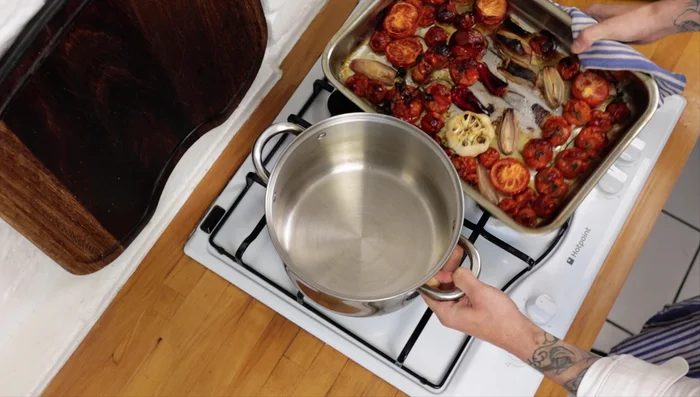 Remove from oven, squeeze the roasted garlic from its skin into the tray (0:94.56).