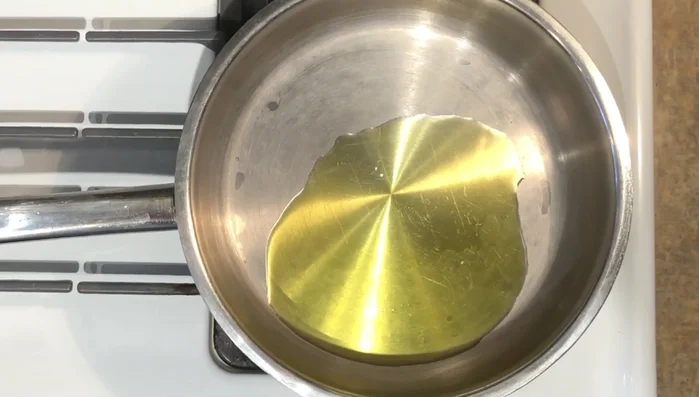 Heat 3 tablespoons of olive oil in a pan. Add chopped half onion and half carrot. Stir-fry until the onion turns golden.