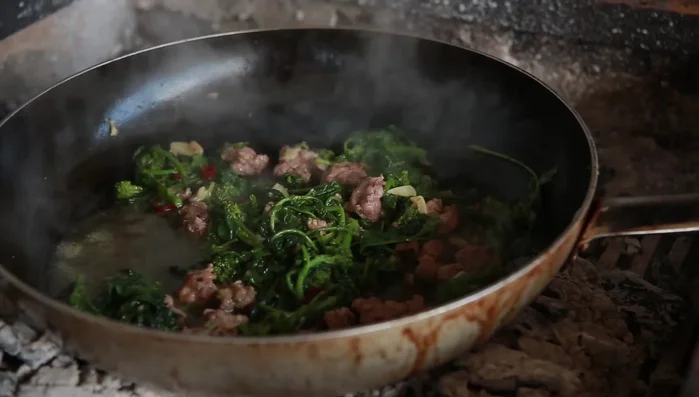 Drain the spaghetti and add it to the pan with the broccoli and sausages.