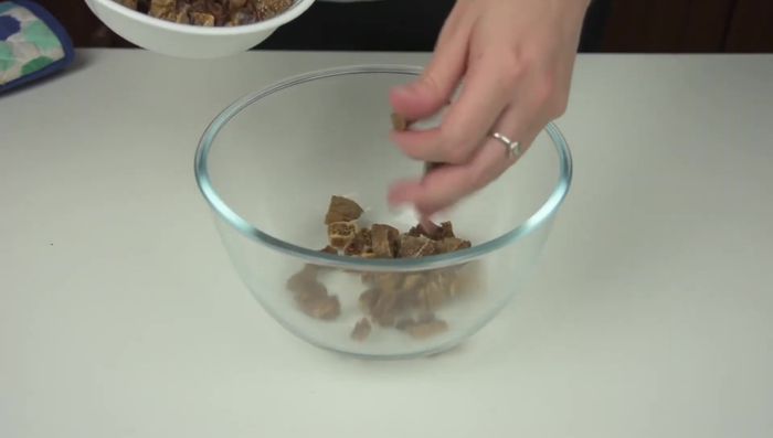 Chop dried figs, dates, and sultanas.