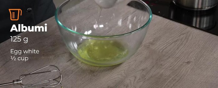 When the syrup reaches 114°C, pour in room-temperature egg whites (ensure no yolk contamination).
