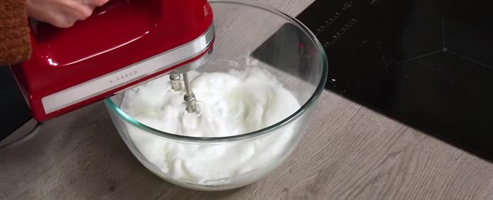 Once the syrup hits 121°C, slowly pour it into the egg whites while whisking, just like the Pâté Bomb.