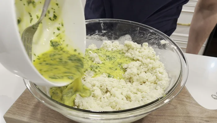 Add the egg mixture to the potatoes and stir until well combined. Add a few tablespoons of milk to incorporate any remaining egg mixture from the bowl and thin the batter slightly.