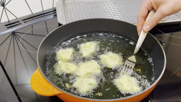 Fry for about 3 minutes per side, or until golden brown. Use a fork to gently nudge them and flip them. Remove to a wired rack to drain.