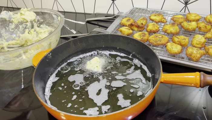 Continue frying remaining batches, ensuring not to overcrowd the pan to maintain oil temperature.
