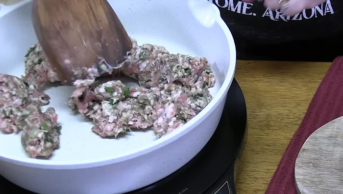 Add 3 cloves of minced garlic to the sausage and cook for 1 minute.